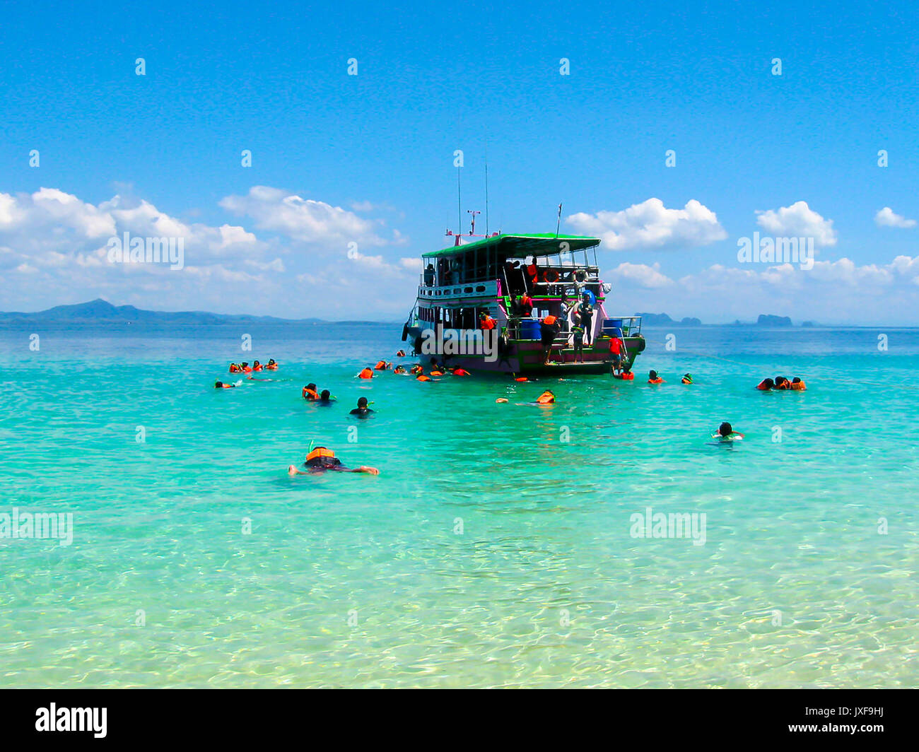 tourists-snorkeling-in-andaman-sea-at-ko-kradan-island-thailand-stock