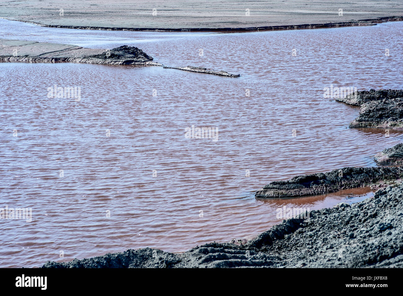 Production waste is accumulated in water. Stock Photo