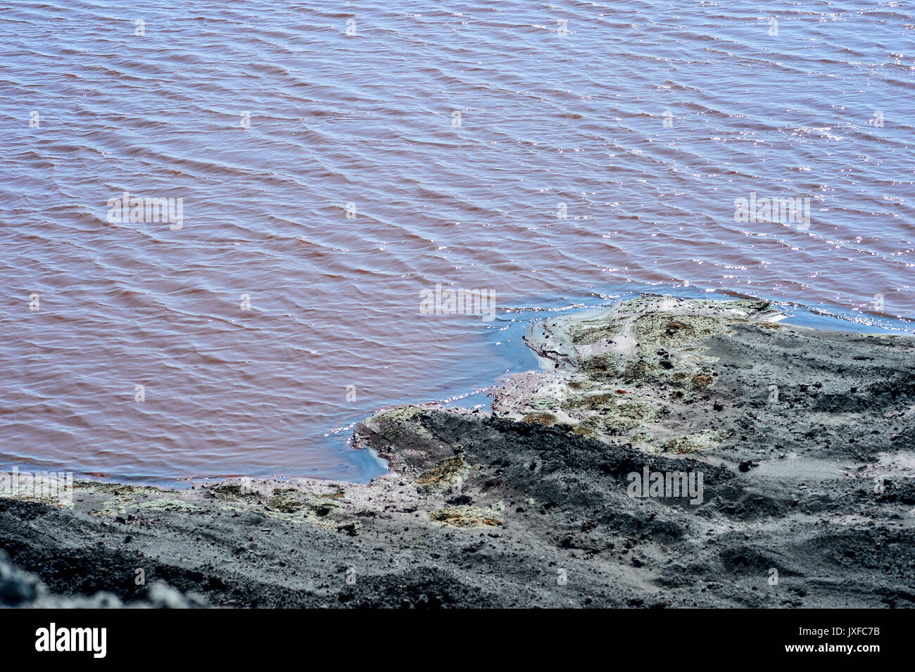 Production waste is accumulated in water. Stock Photo