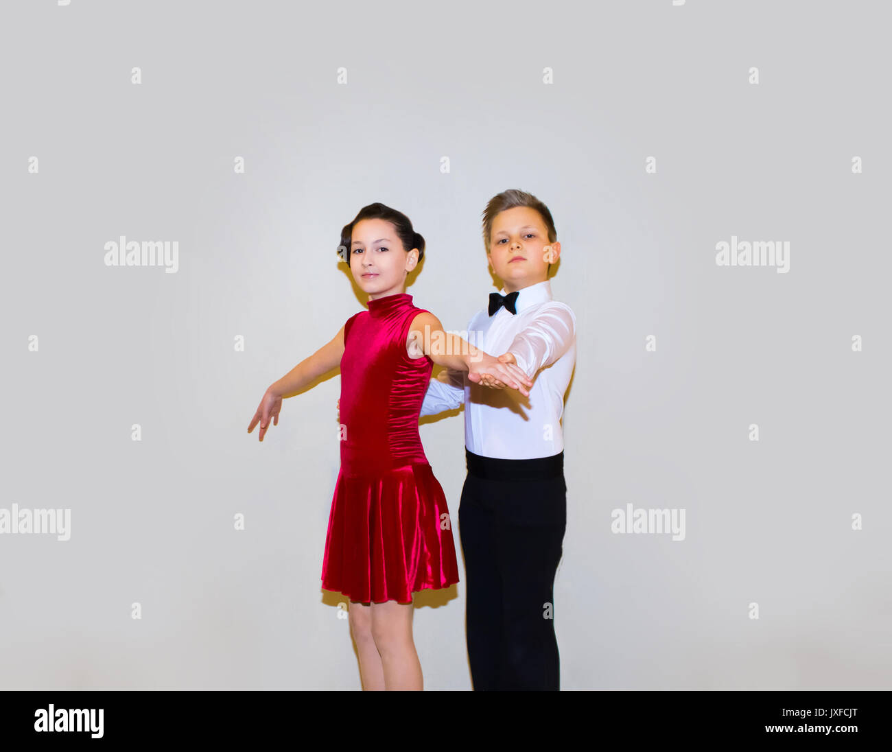 The young boy and girl posing at dance studio Stock Photo