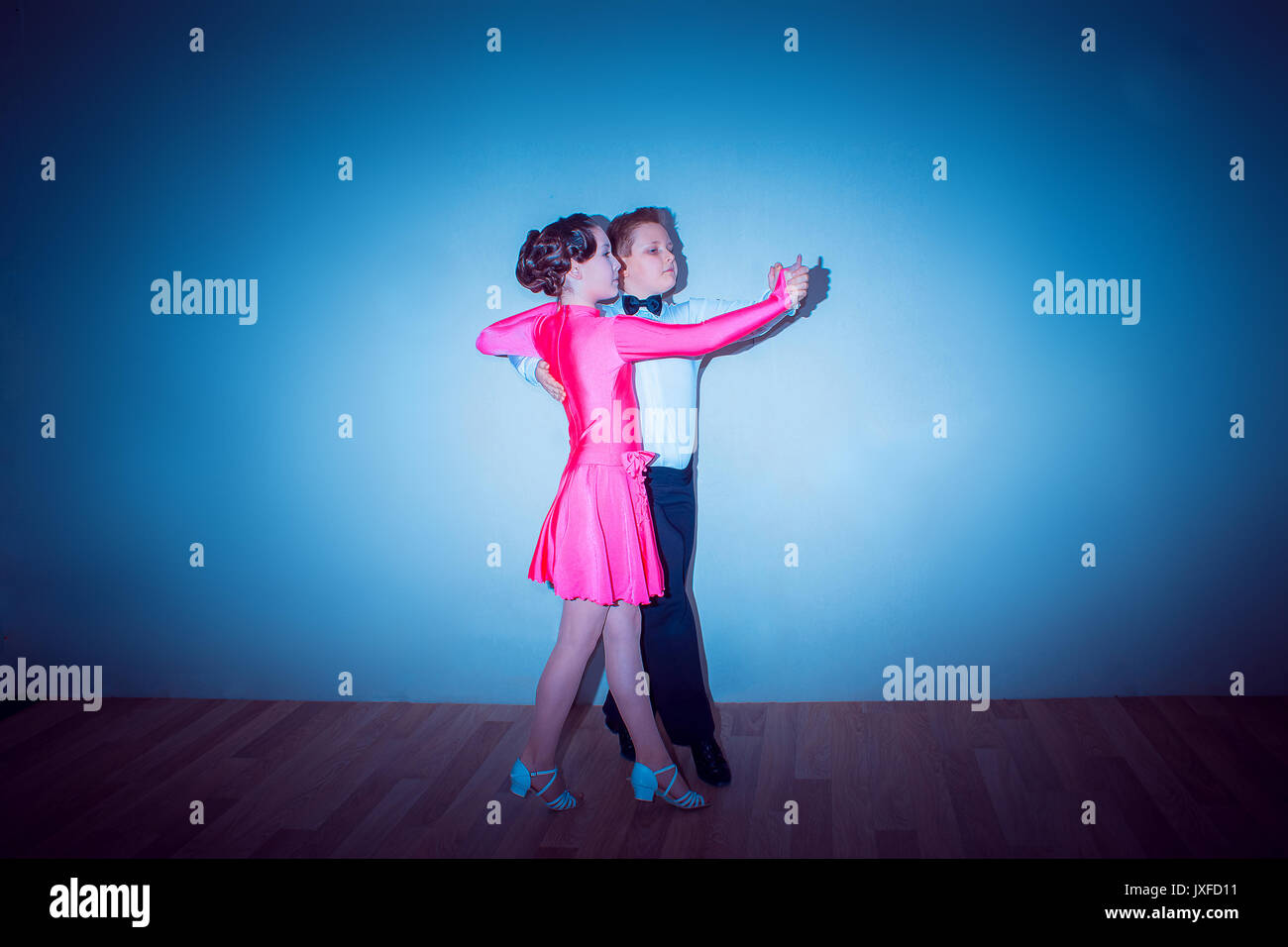 The young boy and girl posing at dance studio Stock Photo Alamy