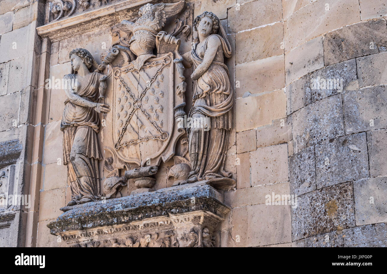 shield of stone framed by two women, relief of the front of the chapel of el salvador of ubeda, jaen province, spain Stock Photo