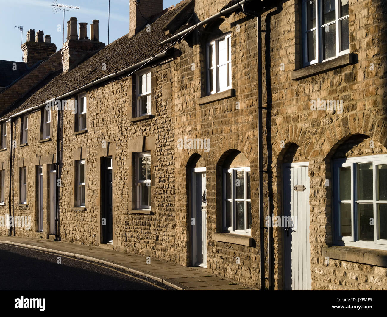 Row of old terraced stone cottages in Austin Street, Stamford, Lincolnshire, UK Stock Photo