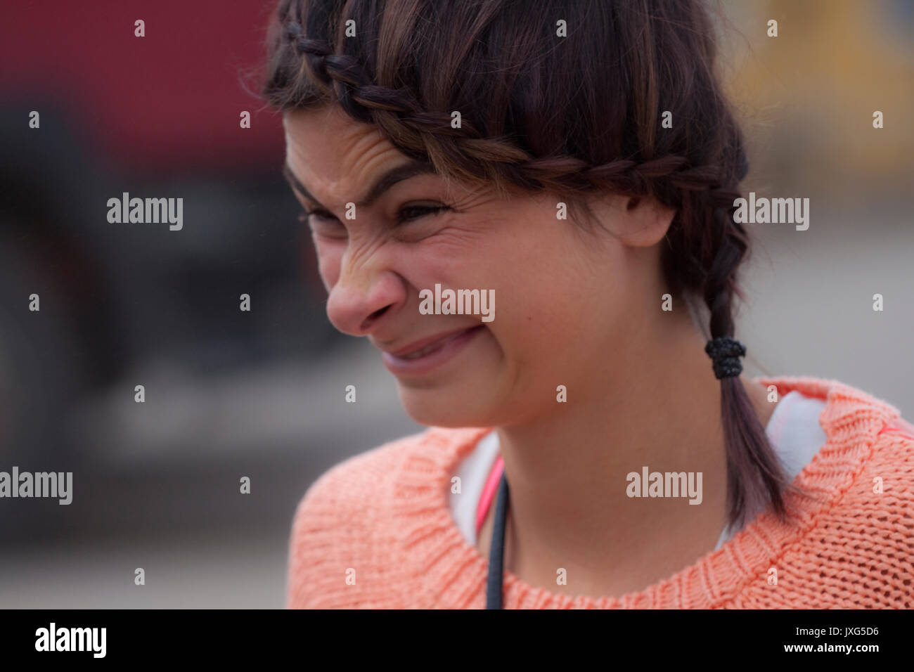 A beautiful girl caught sneezing Stock Photo