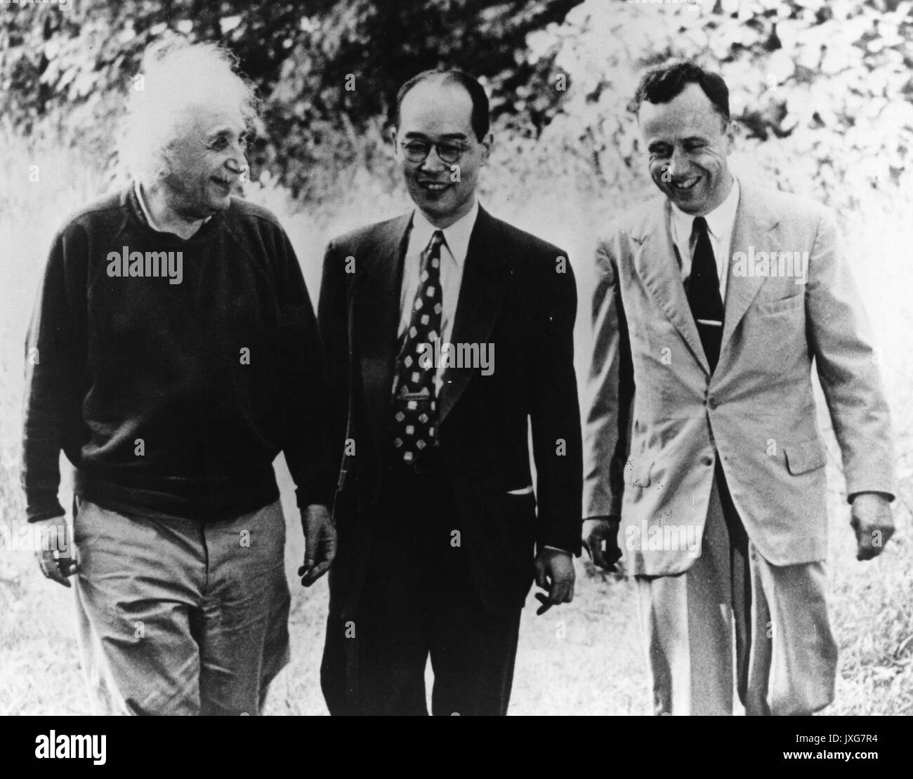 John Archibald Wheeler, Albert Einstein, Hideki Yukawa, Einstein, Yukawa, and Wheeler are conversing together at Princeton, 1954. Stock Photo