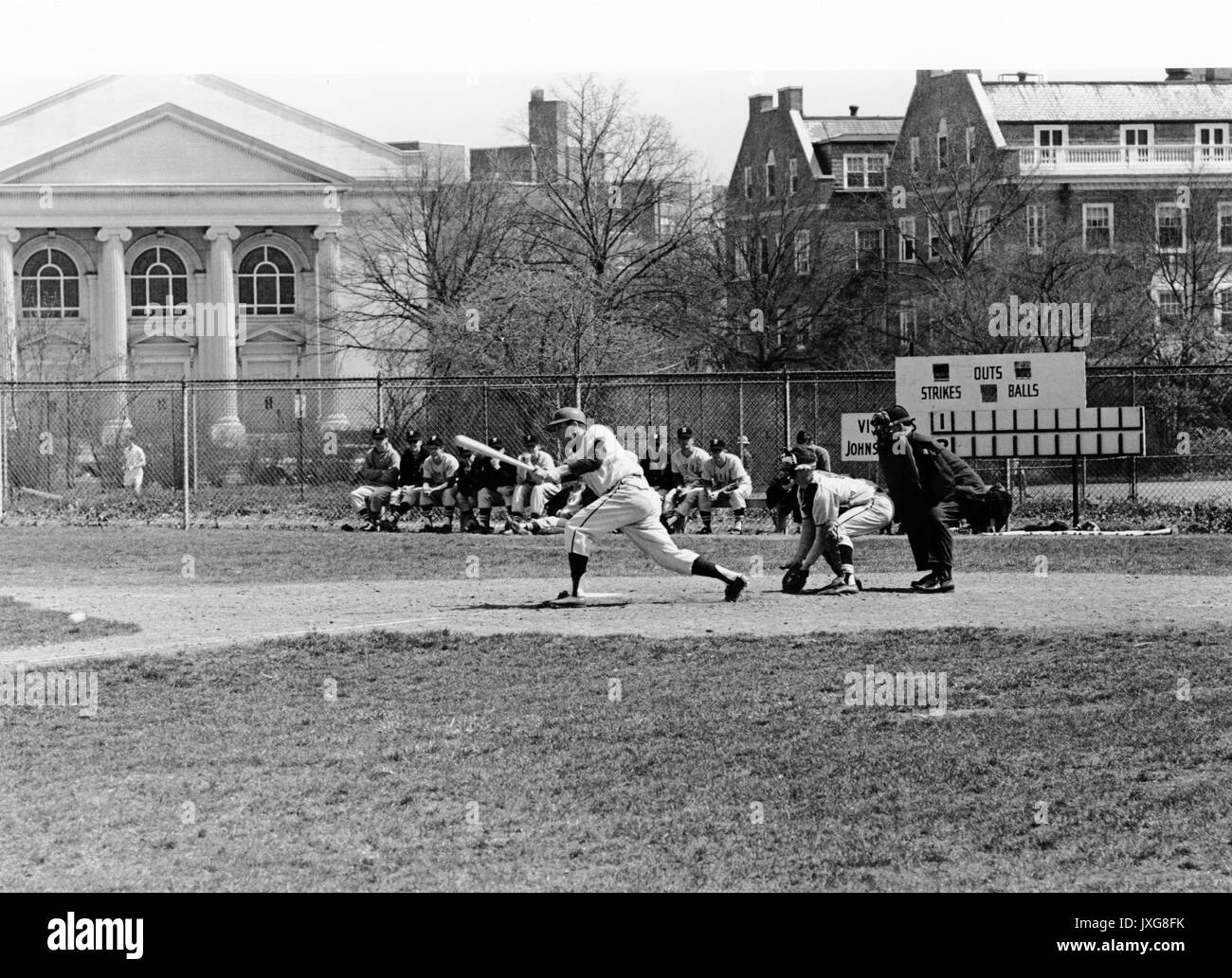 Baseball Action shot taken during the Hopkins vs Harvard game, Hopkins player is at bat, 1963. Stock Photo