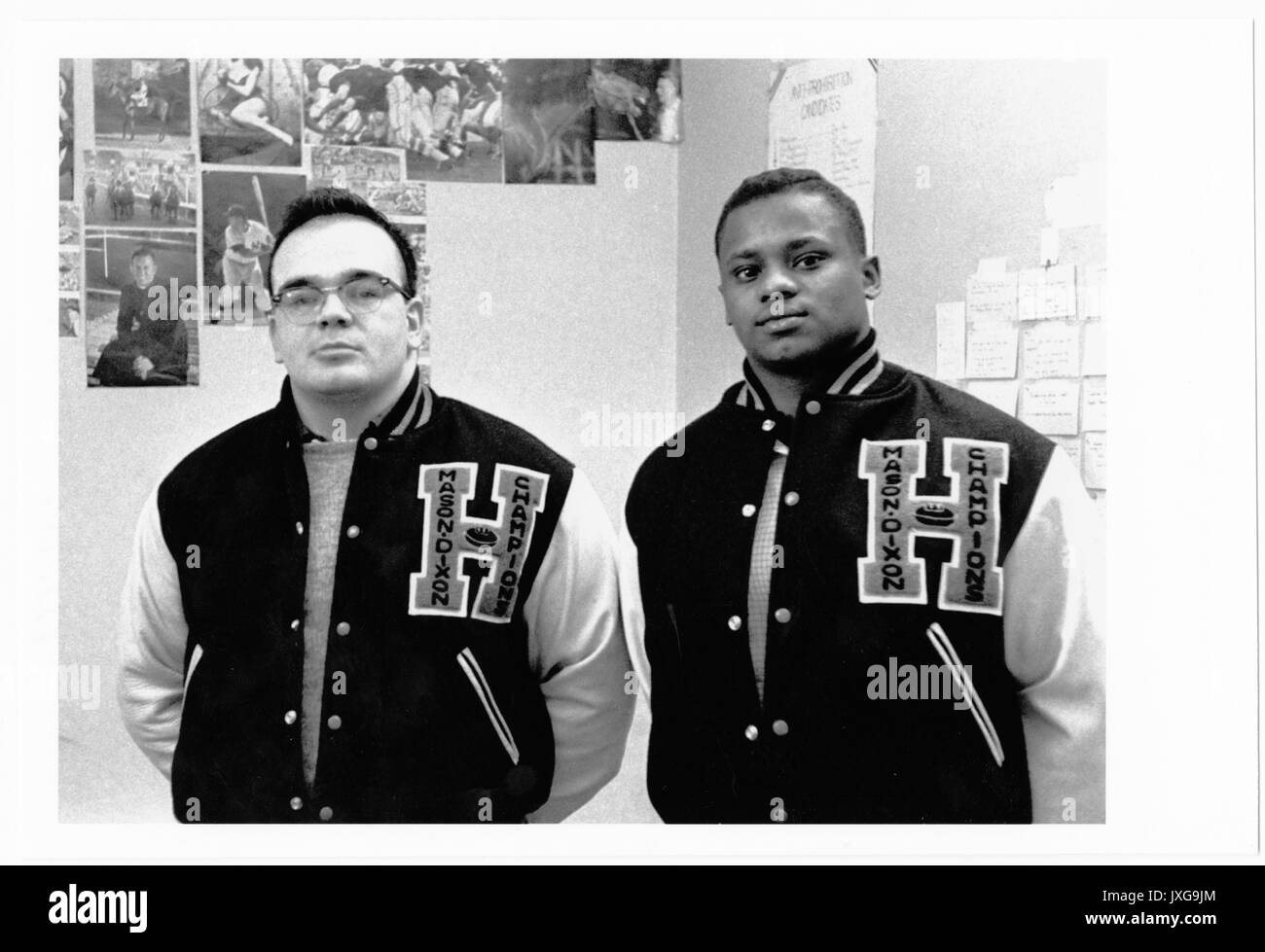 Ernest A Bates, David John Ferrari, African American Students, Bates and Ferrari are standing by the wall in their dorm room, Both are wearing lettermen jackets with Mason-Dixon champions inscribed on the H, 1958. Stock Photo