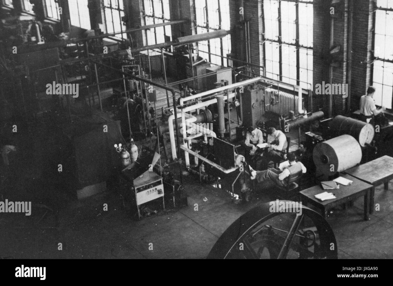 Maryland Hall Interior shot of Machinery Hall, located on the Eastern side of Maryland Hall, Students are taking notes and working with the machines, 1948. Stock Photo