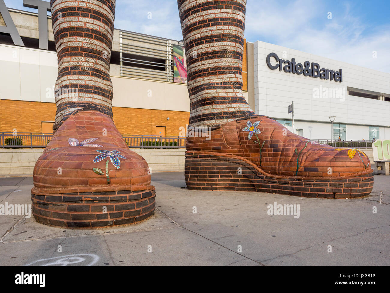 Giant ceramic leg and boot sculpture called 'Immense Mode' at Southgate Transit Centre, Edmonton, Alberta, Canada Stock Photo