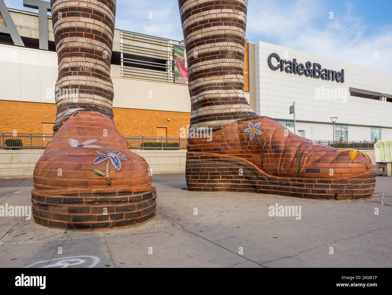 Giant ceramic leg and boot sculpture called "Immense Mode" at Southgate Transit Centre, Edmonton, Alberta, Canada Stock Photo