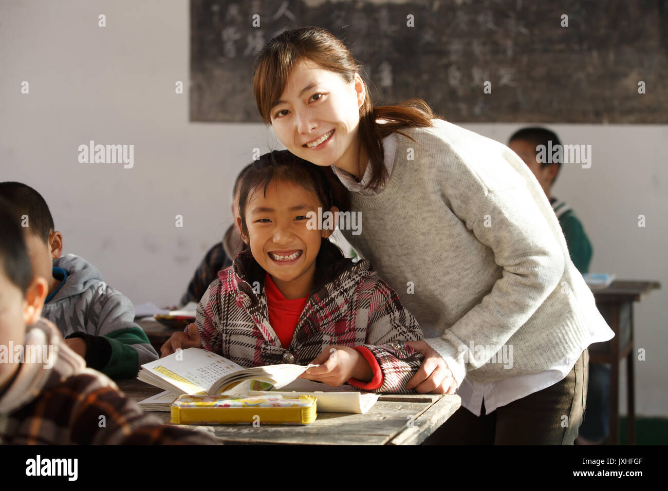 Rural female teachers and pupils in the classroom Stock Photo - Alamy