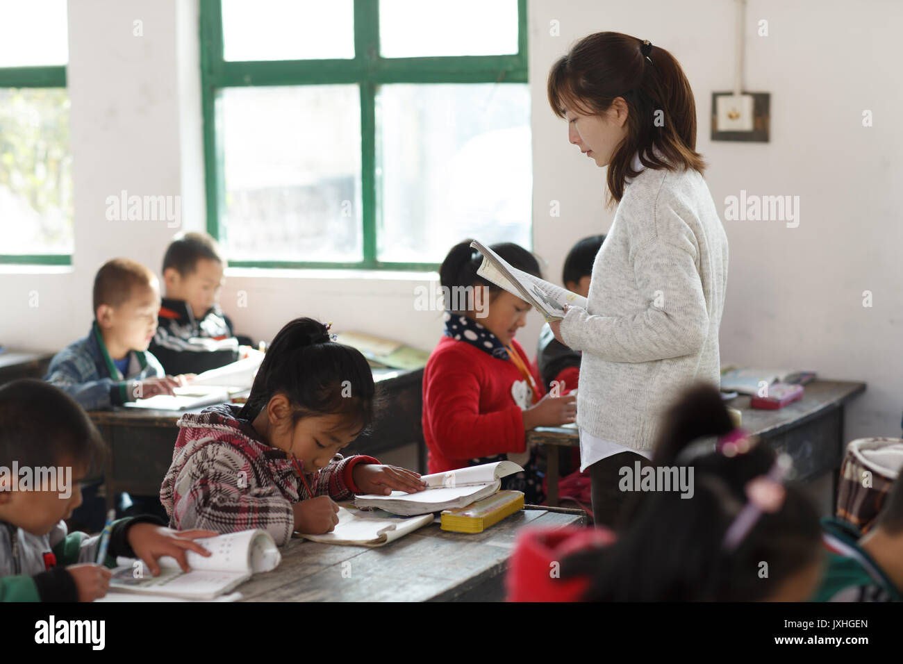 Rural female teachers and pupils in the classroom Stock Photo - Alamy