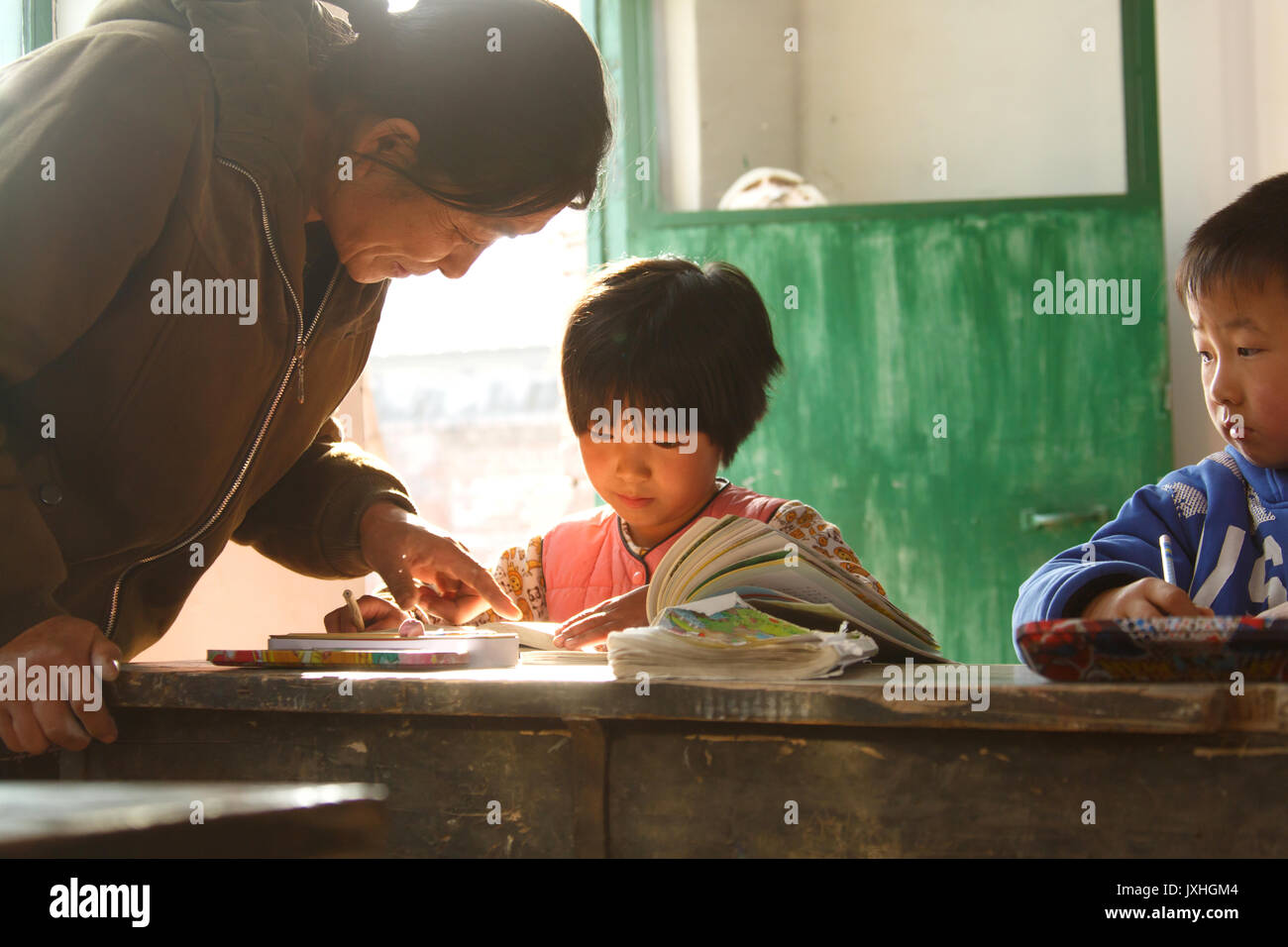 Rural female teachers and pupils in the classroom Stock Photo - Alamy