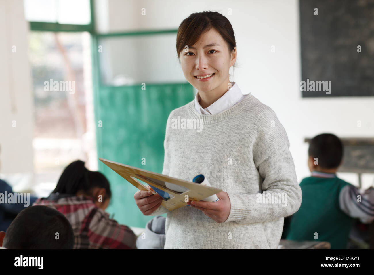 Rural female teachers and pupils in the classroom Stock Photo - Alamy