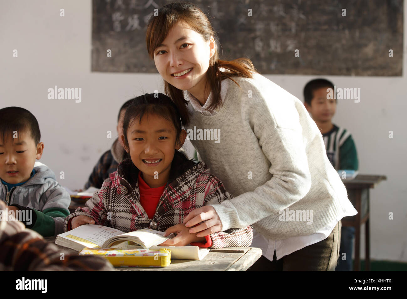Rural female teachers and pupils in the classroom Stock Photo - Alamy