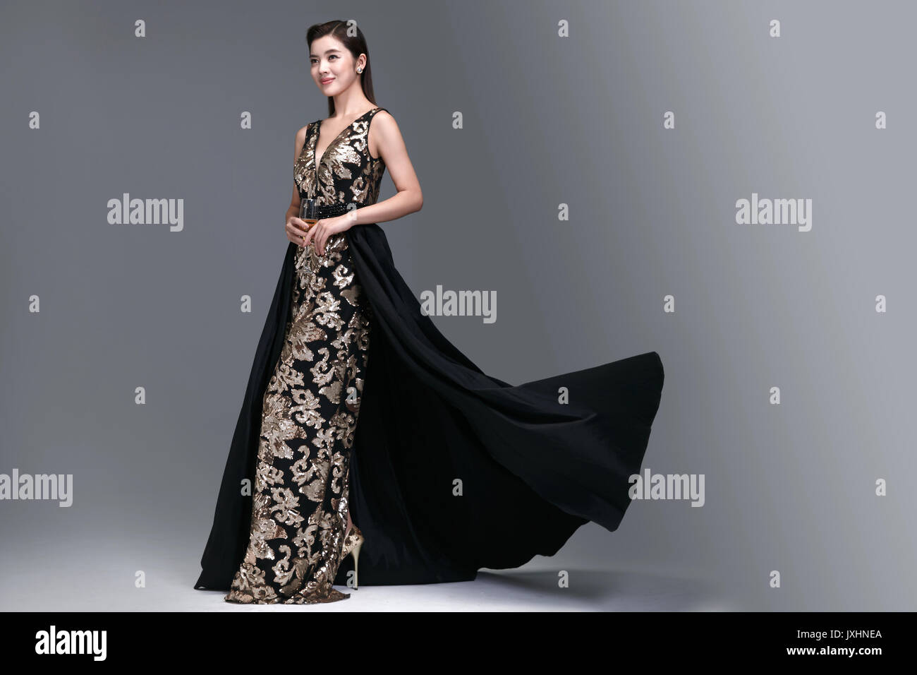 Elegant woman in evening dress hi-res stock photography and images - Alamy