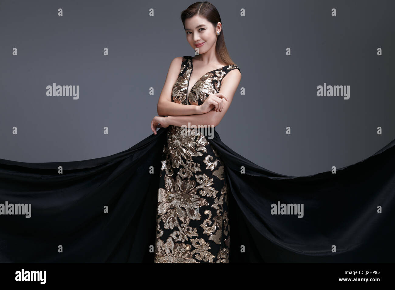 Elegant woman in evening dress hi-res stock photography and images - Alamy