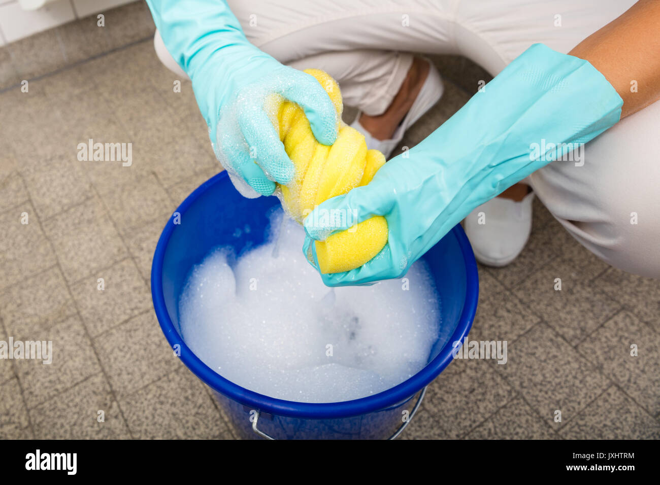 Bucket full of soap suds and hand washing Stock Photo - Alamy