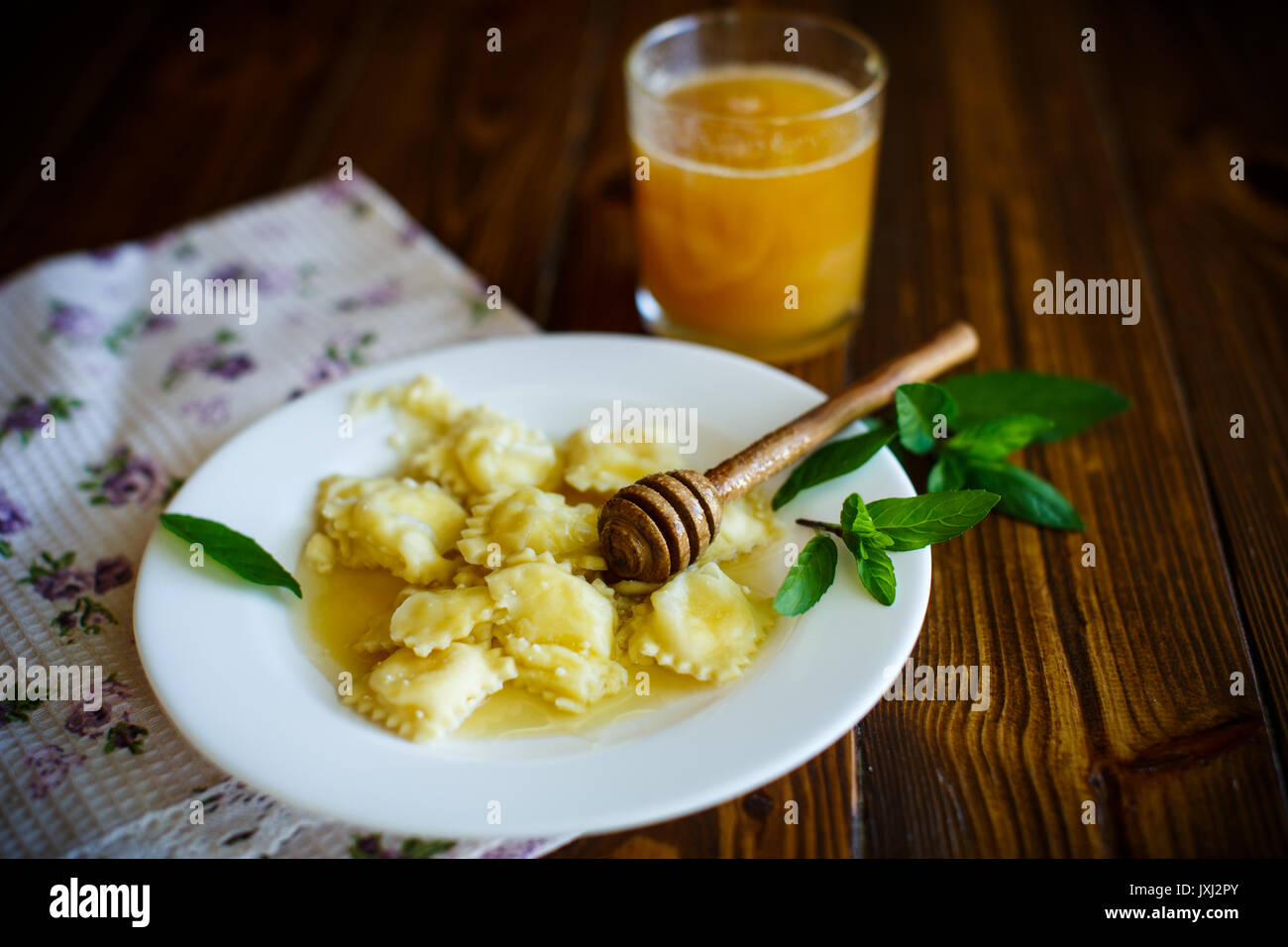 Homemade sweet ravioli with cottage cheese and honey Stock Photo - Alamy