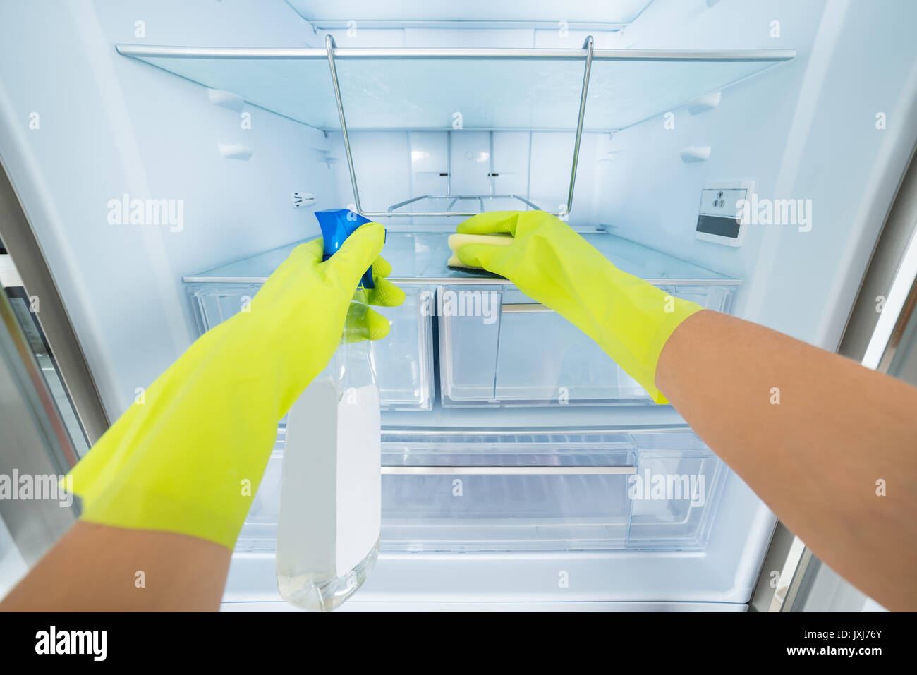 Cleaning Service Professional Woman Hand Wearing Gloves Cleaning The Empty Refrigerator Stock Photo