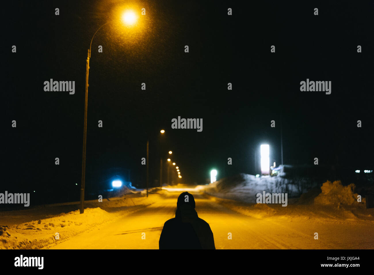 Road in village with streetlights and snow Stock Photo - Alamy