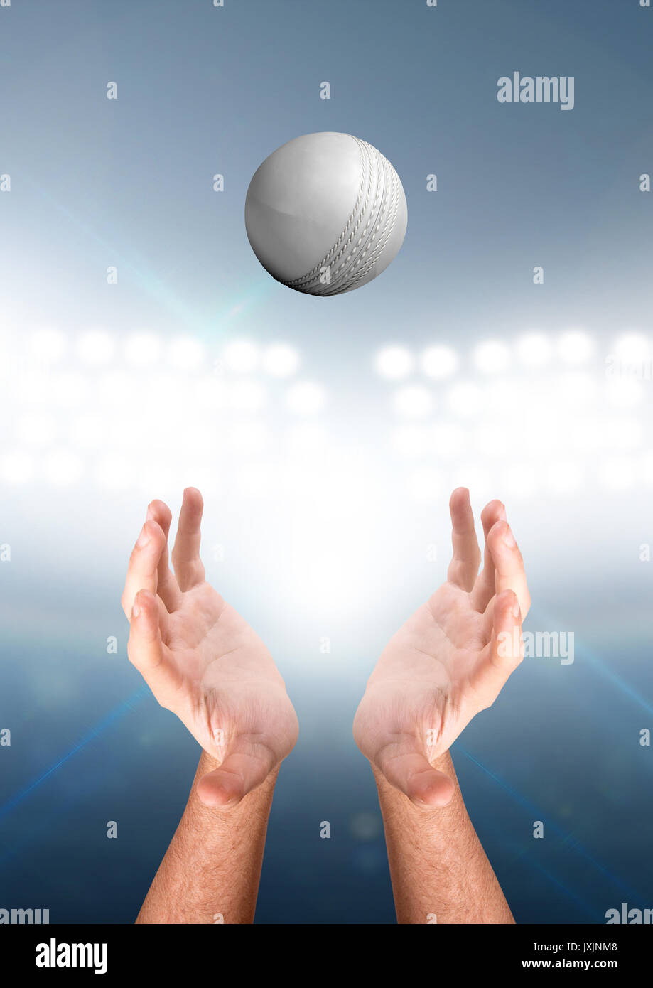 A pair of male hands reaching upwards to catch a cricket ball on a floodlit stadium background - 3D render Stock Photo