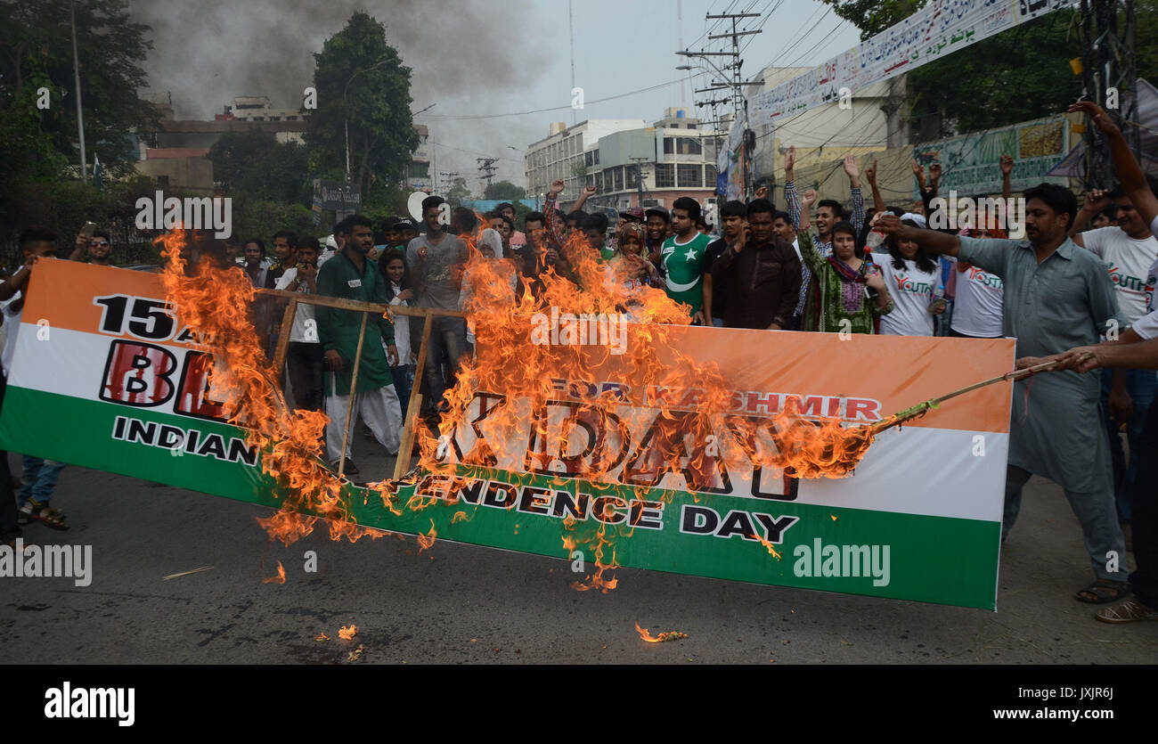 Pakistan. 16th August, 2017. Pakistani members of Youth Forum for Kashmir burn Indian national flag and Indian prime minister Narendra Modi's portrait during demonstration against Indian atrocities in Kashmir in Lahore. Kashmiris on both sides of the line of control and across the world would be observing the Indian Independence Day on August 15 as a black day to convey the message to the international community that India has usurped their inalienable right to self-determination. Credit: PACIFIC PRESS/Alamy Live News Stock Photo