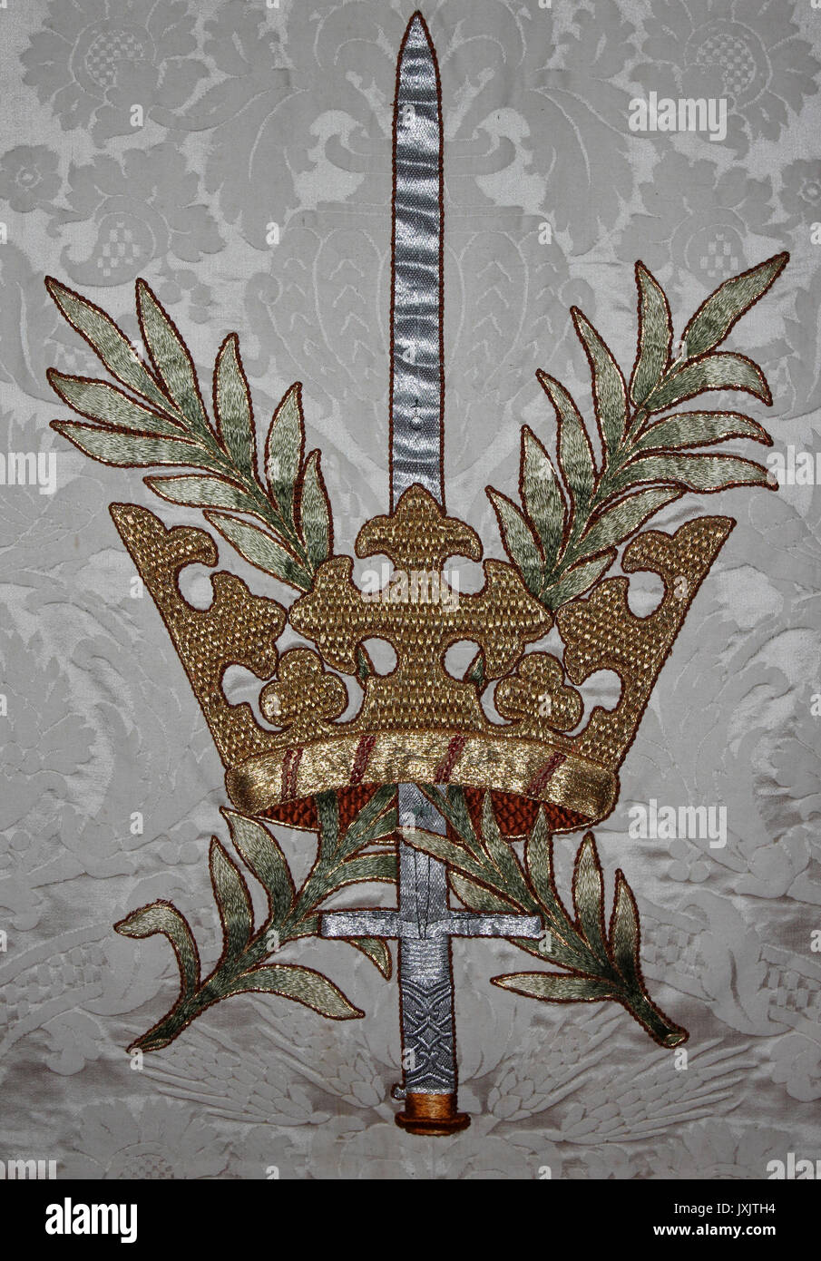 Sword and Crown Embrioidery on Altar Cloth, Medieval Church of St Mary's, Caerhun, Wales Stock Photo