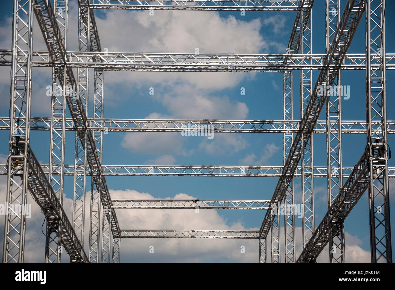 huge metal construction against blue sky and clouds Stock Photo