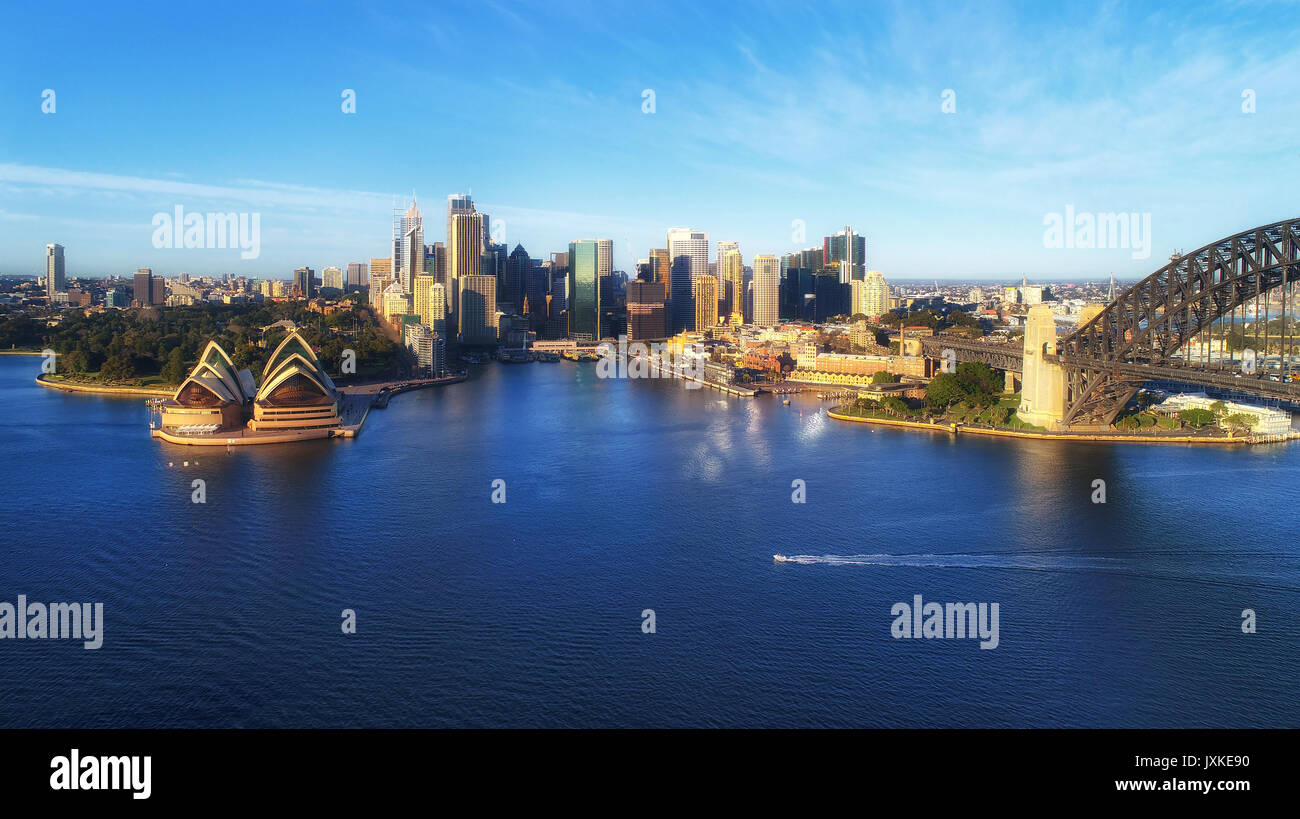 Sydney city landmarks around harbour waters - Harbour bridge, CBD, Circular Quay and the Rocks viewed from above. Stock Photo