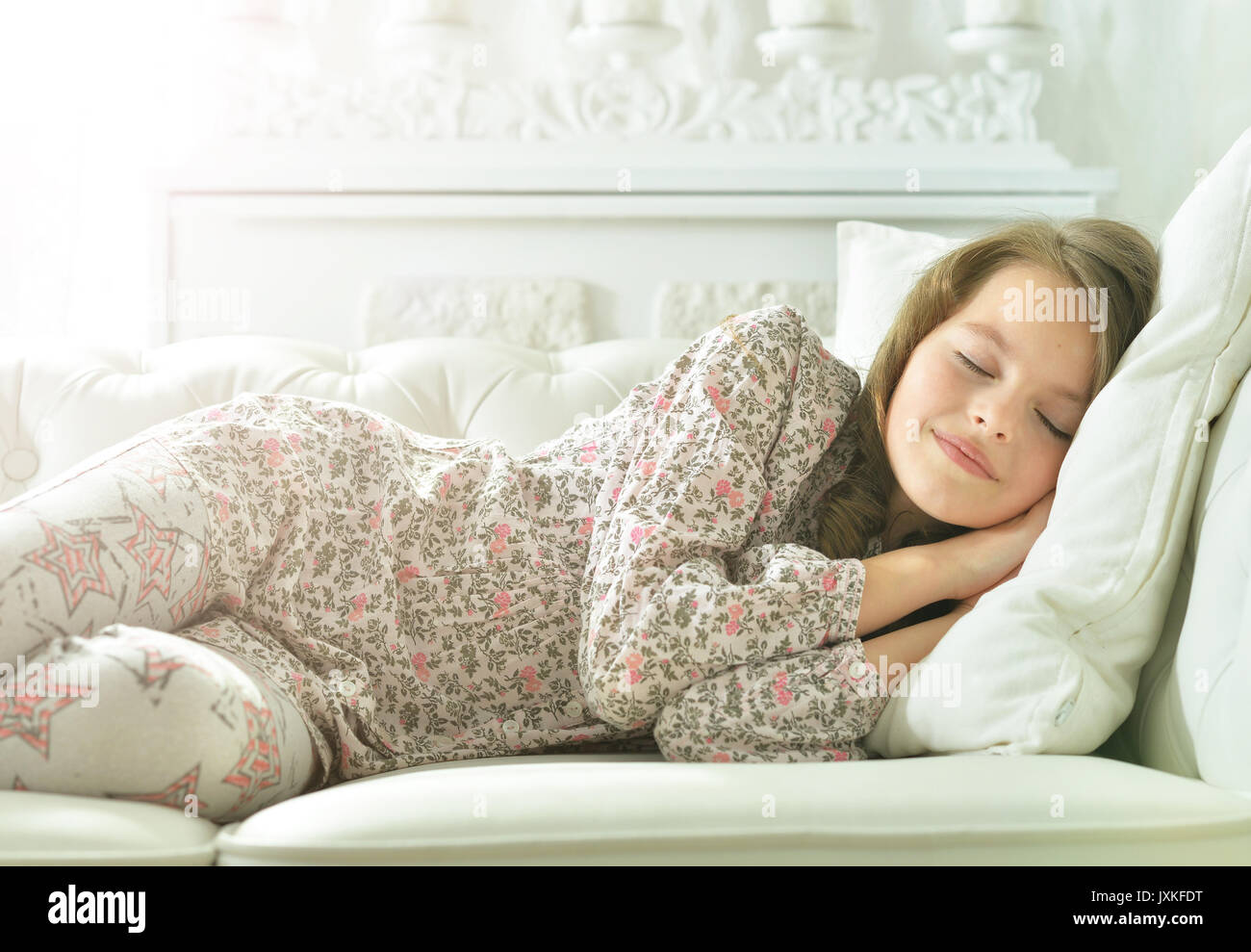 little girl in pajama sleeping on couch Stock Photo Alamy