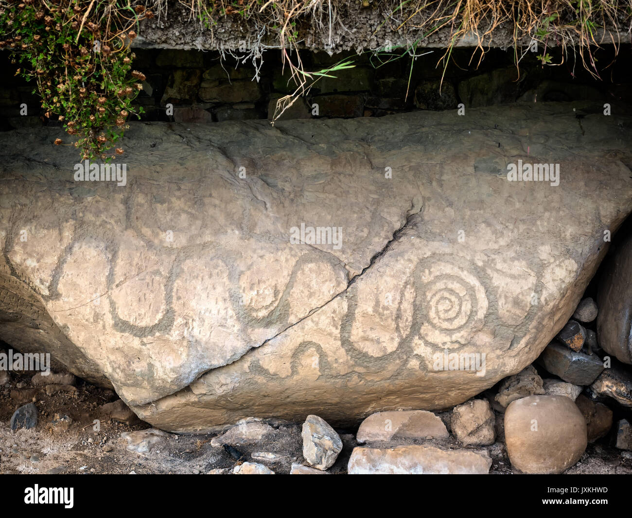 Knowth Neolithic Mound, Kerbstone with spirals and lozenges in Ireland Stock Photo