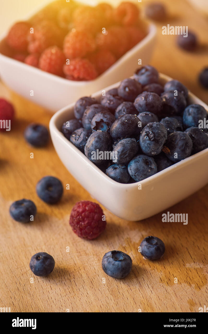 Blueberries in ceramic bowl, fresh berry fruit, selective focus Stock Photo