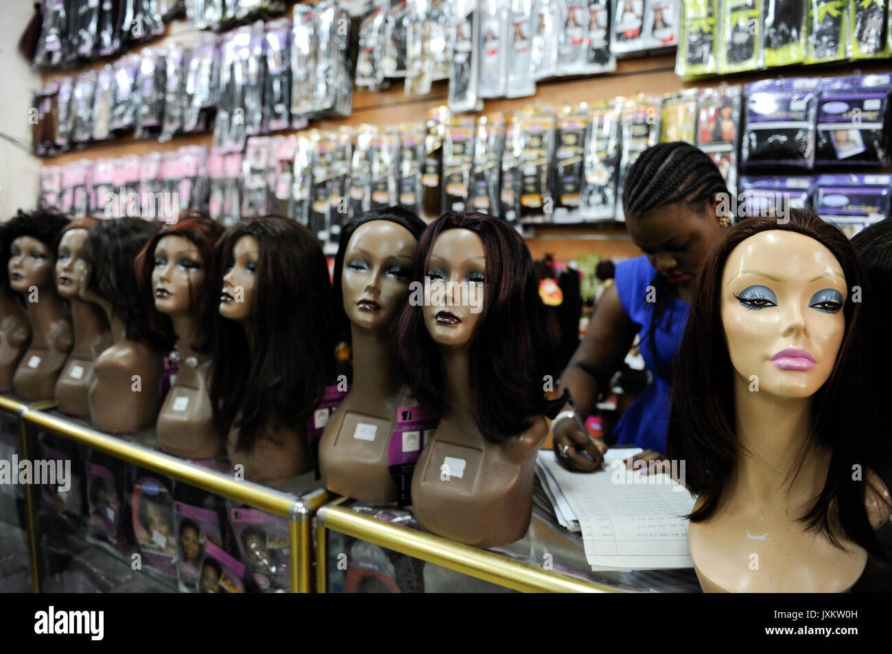 TANZANIA Dar es Salaam, shop sells artificial or natural straight hair for women, often the hair comes from head shavings in Hindu temple in India, is then processed in China and after sold to africa, the eauty ideal is straight hair instead of curly hair Stock Photo
