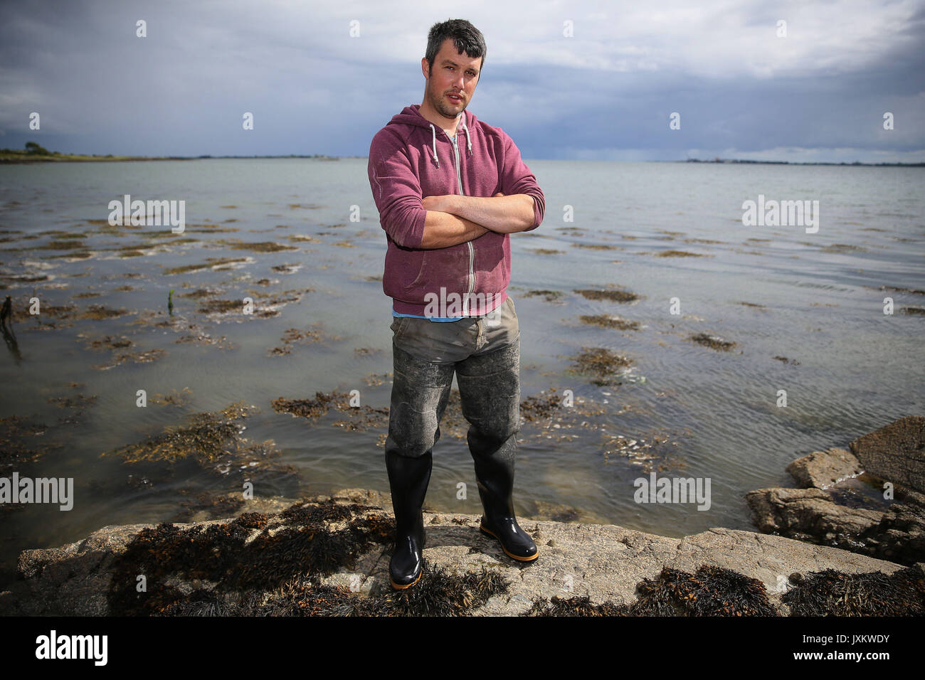 Oyster farmer and owner of Killowen Shellfish Darren Cunningham, at Carlingford Lough in Newry. Shellfish farmers selling tonnes of oysters in Europe have said post-Brexit customs and border ideas are &quot;utterly deluded&quot; and could wipe out their businesses. Stock Photo