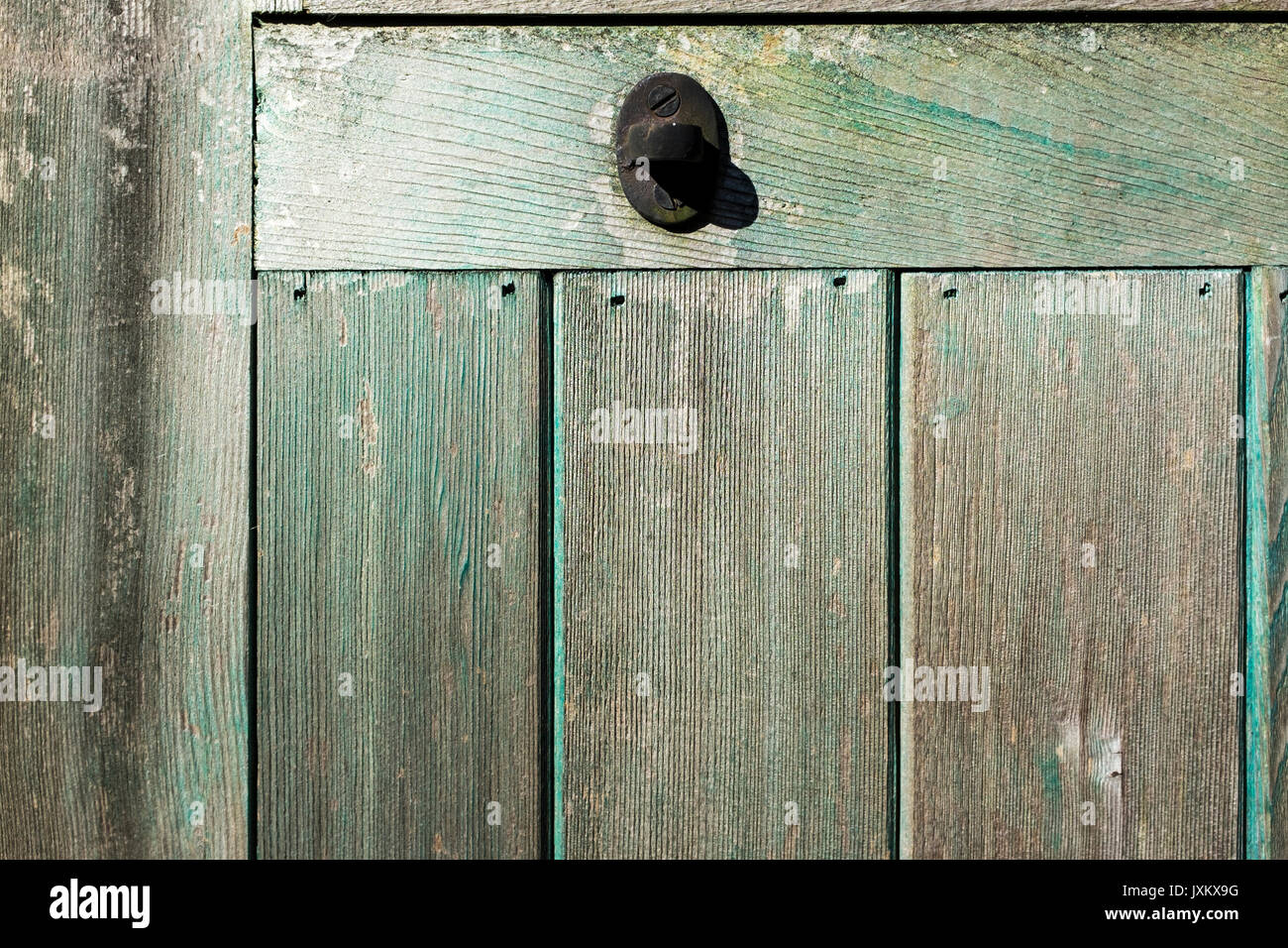 Close up of a panel on a green wooden greenhouse Stock Photo