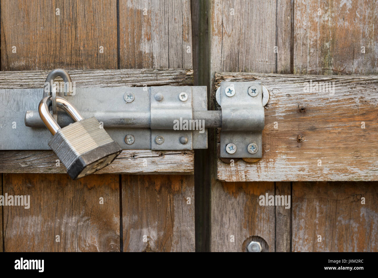 Heavy duty lock and padlock on wooden 