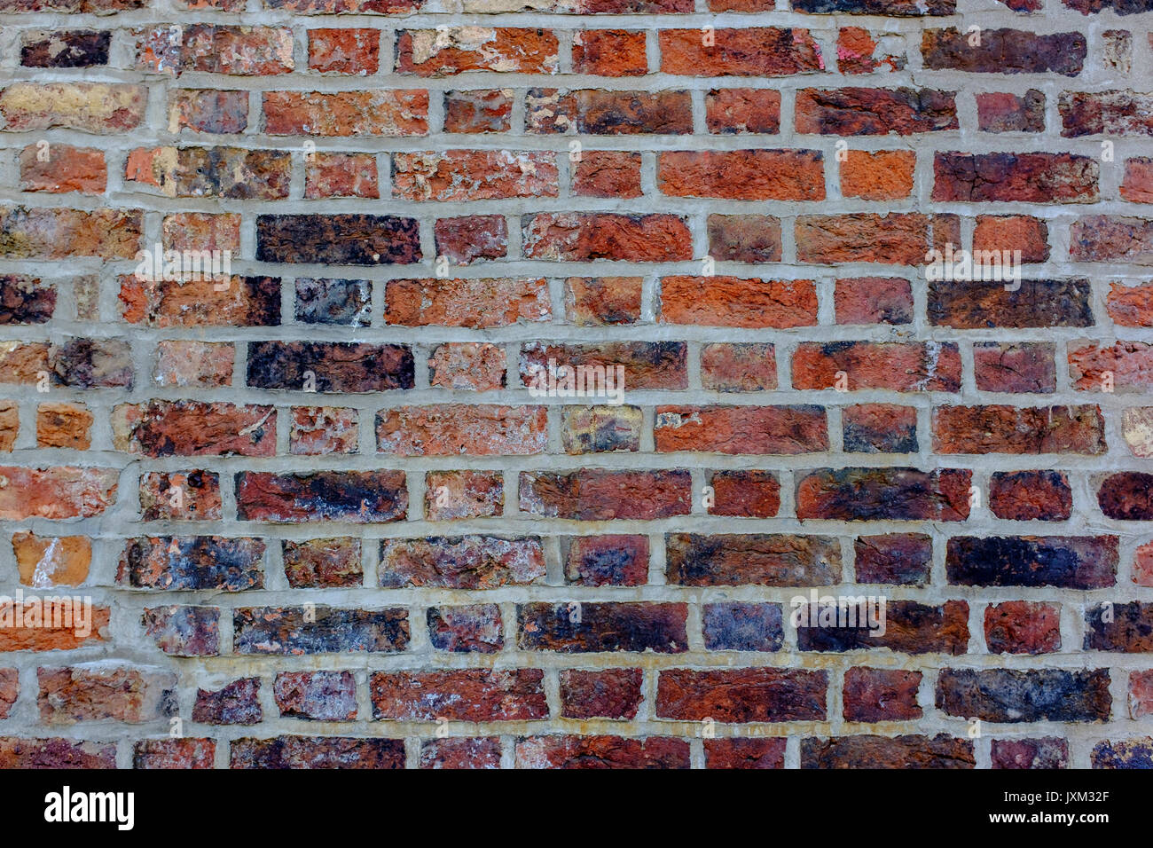 Red brick wall, straight on. Stock Photo