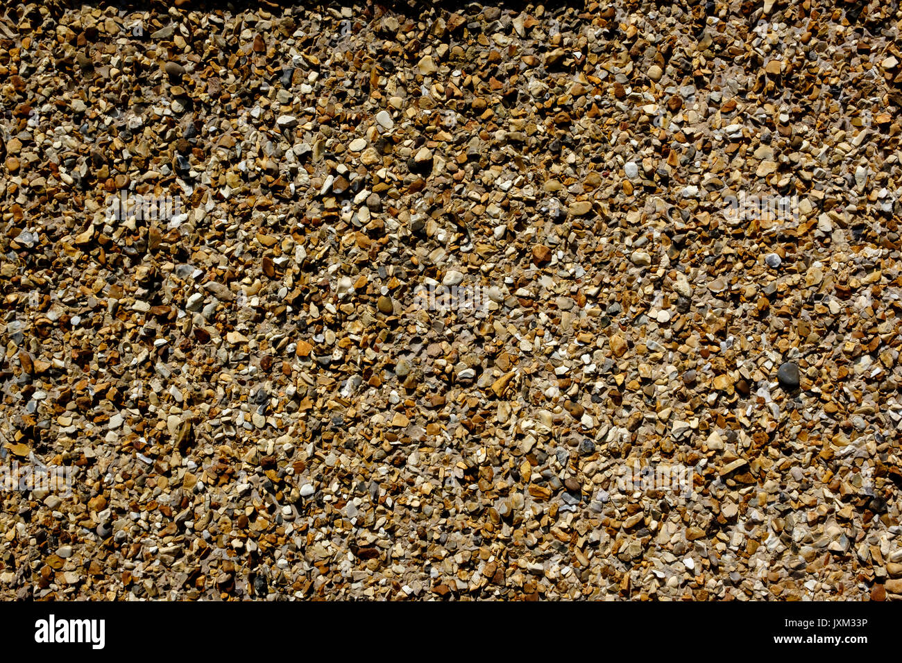 Close up of a pebble dashed wall on a 1930's suburban house Stock Photo