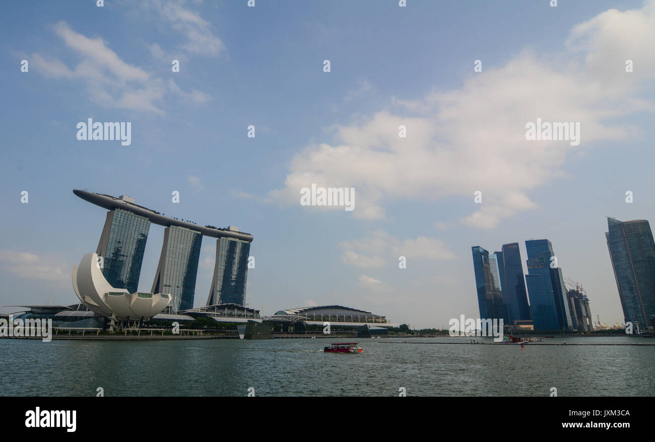 Singapore - Jul 3, 2015. View of the Marina Bay at sunny day in Singapore. Since independence in 1965, the Singapore economy has experienced rapid eco Stock Photo