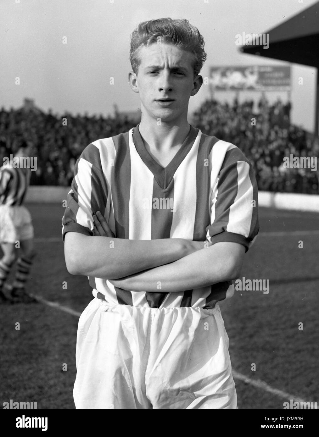 Sixteen-year-old Denis Law has been called a second Alex James since his League football debut recently at inside-right for Huddersfield Town. He was signed direct from school and he has been working on their Leeds Road ground staff. Stock Photo