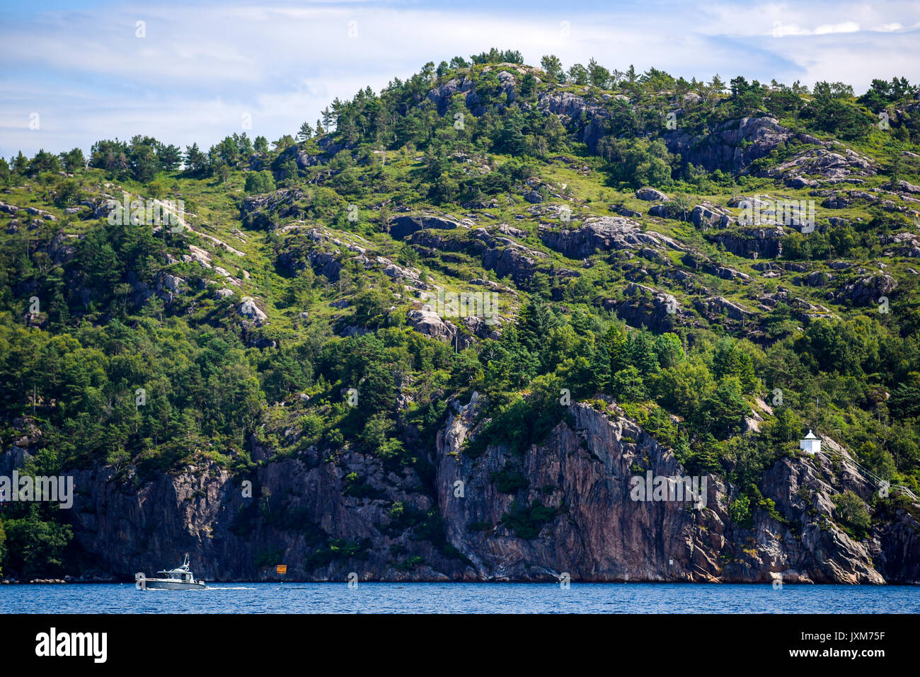 Landscape of the Norwegian coast, water, rocks and forest, summer time ...