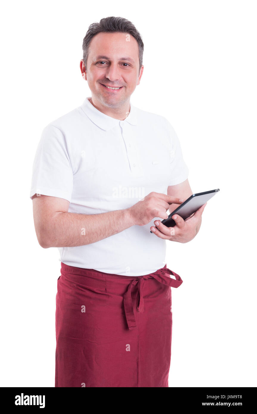 Happy butcher doing the checklist on modern tablet and smiling isolated ...