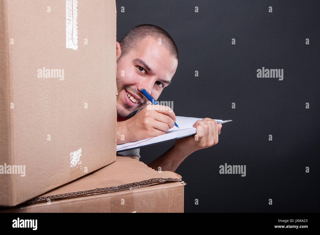 Man hiding behind cardboard box hires stock photography and images Alamy