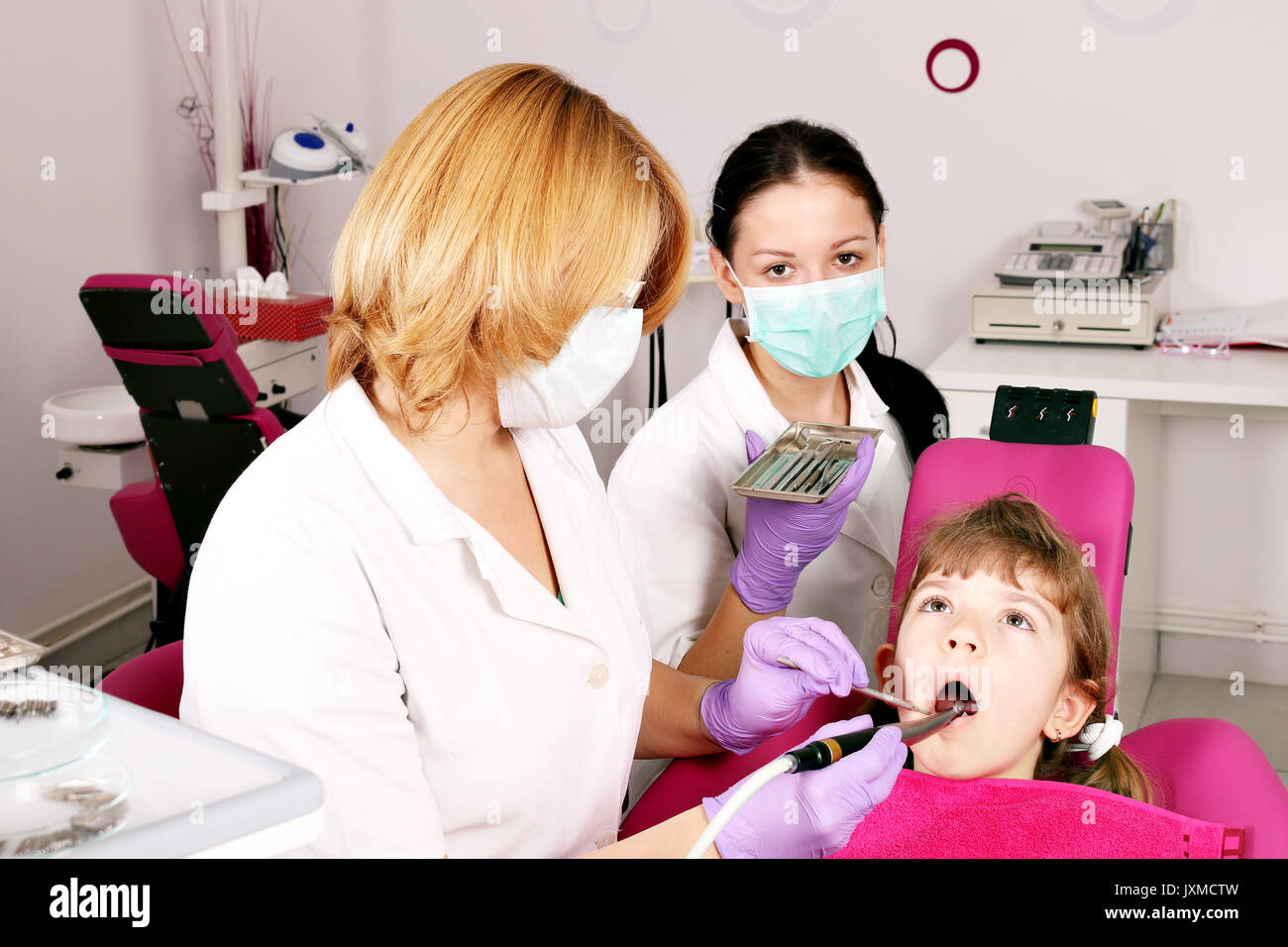 dentist nurse and child dental exam Stock Photo