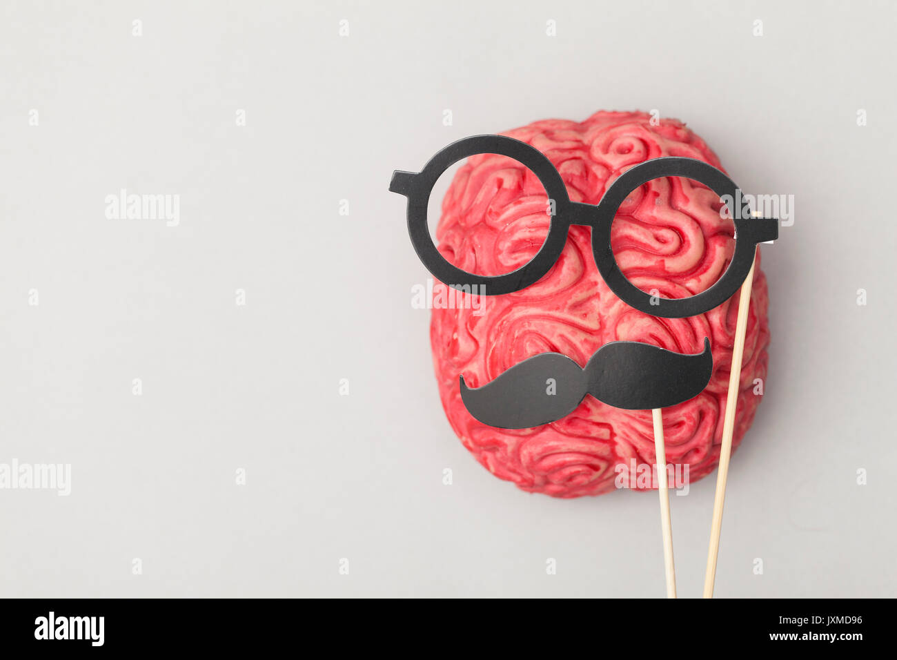 Human brain with comedy props Stock Photo