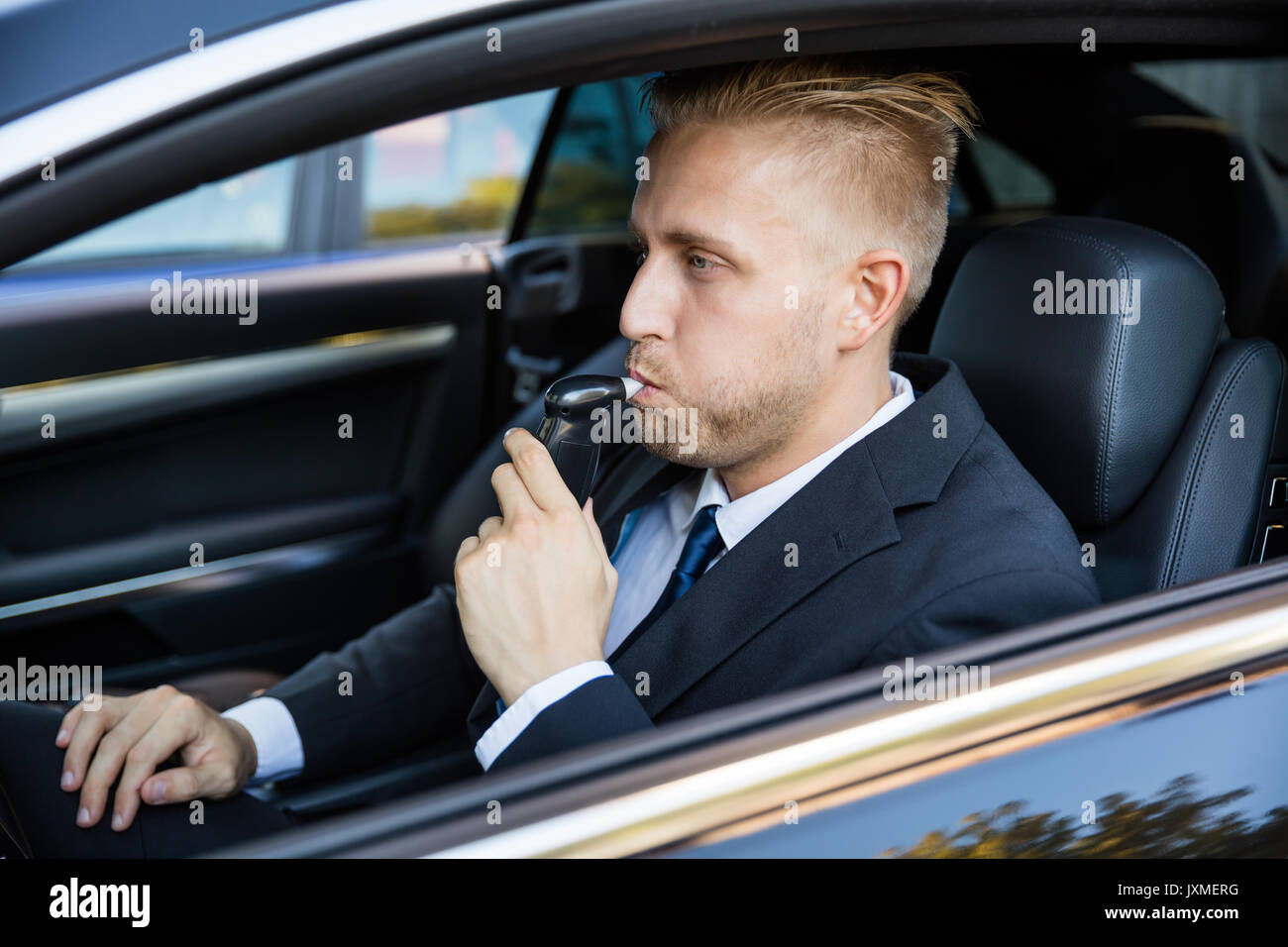 Man Sitting Inside Car Taking Alcohol Test Stock Photo Alamy