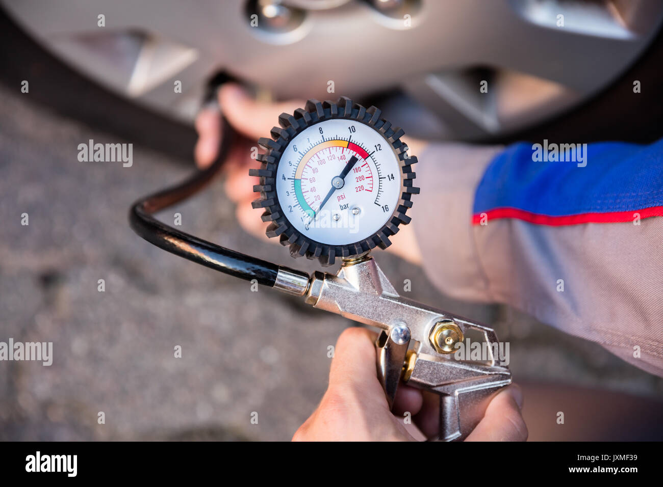 Person Measuring Car Tyre Pressure With Pressure Gauge Stock Photo - Alamy