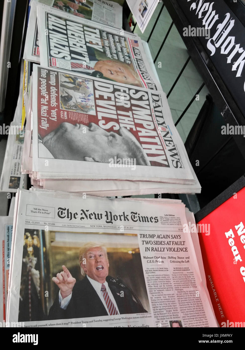 New York newspapers on Wednesday, August 16, 2017 report on the previous day's press conference where President Donald Trump's statements supported the alt-right, neo-Nazis and white supremacists at the melee in Charlottesville, Virginia. (© Richard B. Levine) Stock Photo