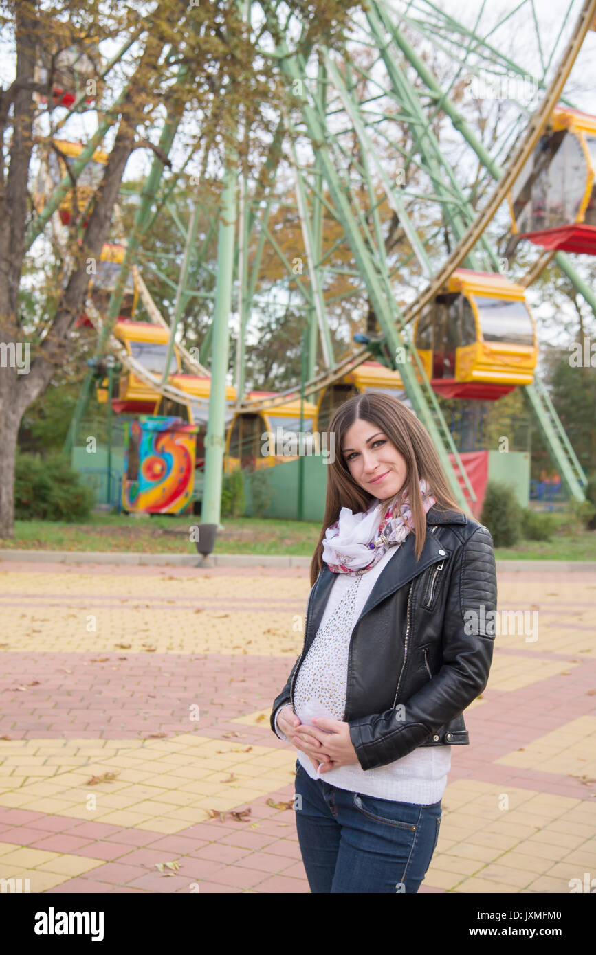 The pregnant girl on walk in city park Stock Photo - Alamy